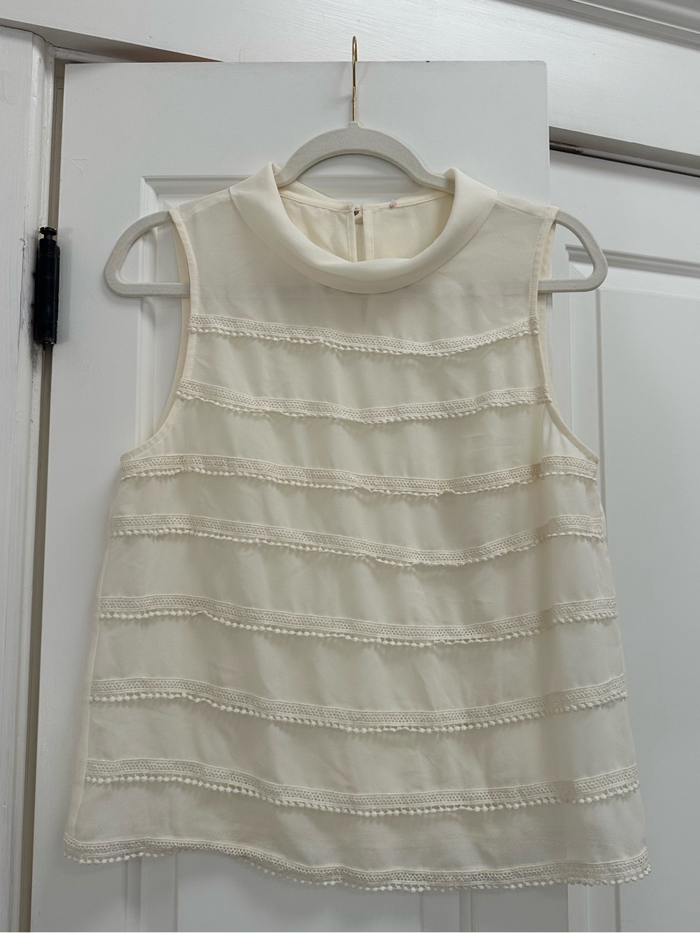 Cream blouse with scalloped trim